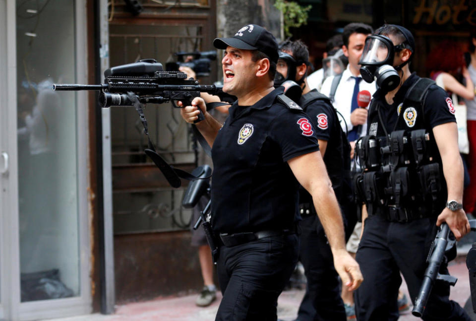 Riot police use rubber pellets