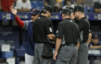 Boston Red Sox manager Alex Cora yells as he talks to the umpiring crew during the eighth inning of a baseball game against the Tampa Bay Rays Wednesday, July 24, 2019, in St. Petersburg, Fla. Cora was upset about the Rays moving pitcher Adam Kolarek from pitcher to first base and then back to pitcher during the inning. (AP Photo/Chris O'Meara)