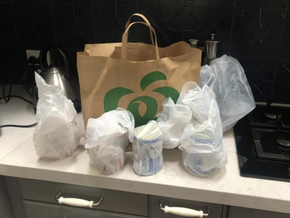 A Woolworths shopper said her online delivery was packed in plastic bags despite paying extra for paper ones.