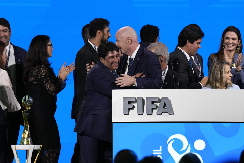 President of the Football Associated of Brazil Ednaldo Rodrigues, left, hug FIFA President Gianni Infantino after Brazil was choosen to host the 2027 Women's World Cup soccer at the FIFA Congress in Bangkok, Thailand, Friday, May 17, 2024. Brazil will host the 2027 Women’s World Cup after a vote of FIFA’s full membership chose the South American bid over a joint proposal from Belgium, Netherlands and Germany.(AP Photo/Sakchai Lalit)