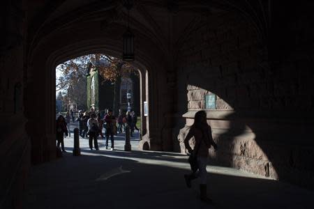 People walk around the Princeton University campus in New Jersey, November 16, 2013. REUTERS/Eduardo Munoz