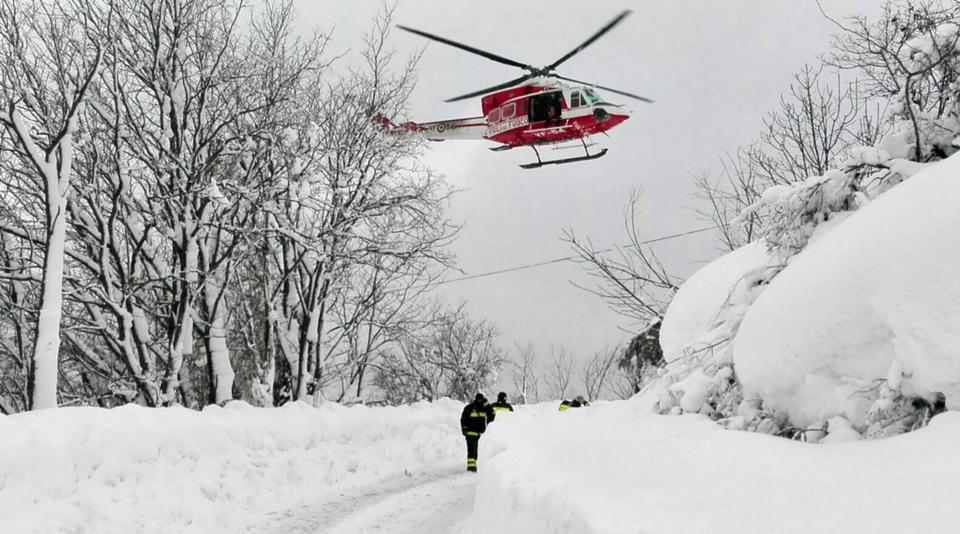 A helicopter departs the scene (Picture: AP)