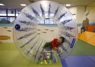 Two-year-old Sakuya Zui plays at an indoor playground which was built for children and parents who refrain from playing outside because of concerns about nuclear radiation in Koriyama, west of the tsunami-crippled Fukushima Daiichi nuclear power plant, Fukushima prefecture February 27, 2014. REUTERS/Toru Hanai