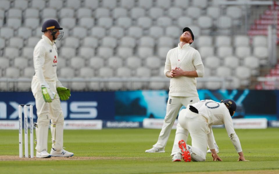 England's Ben Stokes reacts after Jos Buttler missed a catch - REUTERS