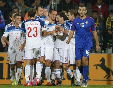 Russia's Sergei Ignashevich (C) celebrates his goal with team mates during their Euro 2016 group G qualifying soccer match against Moldova at the Zimbru stadium in Chisinau, Moldova, October 9, 2015. REUTERS/Gleb Garanich