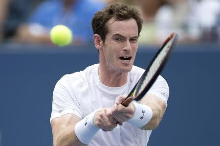 Andy Murray of Britain returns a shot to Adrian Mannarino of France during their second round match at the U.S. Open Championships tennis tournament in New York, September 3, 2015. REUTERS/Carlo Allegri