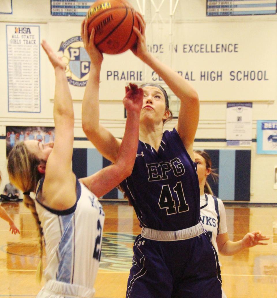 Kaylea Randall of El Paso-Gridley tries to take a shot against Prairie Central's Mariya Sisco. Randall had 13 points and 10 rebounds in a losing effort for the Titans.