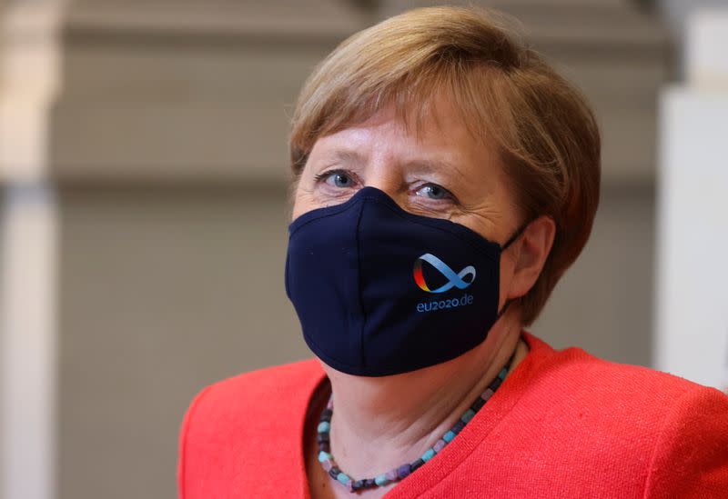 German Chancellor Angela Merkel wearing a face mask is seen after a session at the upper house of the German parliament Bundesrat, following the outbreak of the coronavirus disease (COVID-19), in Berlin
