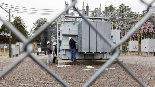 PHOTO: Duke Energy workers inspect a transformer radiator that they said was damaged by gunfire that crippled an electrical substation after the Moore County Sheriff said that vandalism caused a mass power outage, in Carthage, North Carolina, Dec. 4, 2022 (Jonathan Drake/Reuters)