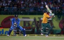 South Africa's AB de Villiers was clean bowled by IndiaÃ¢â‚¬â„¢s Ravichandran Ashwin (not pictured) as India's captain Mahendra Singh Dhoni (L) watches during their first Twenty-20 cricket match in the northern Indian hill town of Dharamsala, India, October 2, 2015. REUTERS/Adnan Abidi