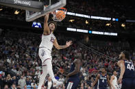 Gonzaga forward Anton Watson dunks in the first half of an Elite 8 college basketball game against UConn in the West Region final of the NCAA Tournament, Saturday, March 25, 2023, in Las Vegas. (AP Photo/John Locher)