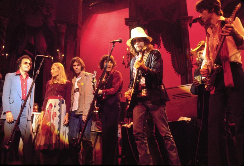 Classic rockers Neil Diamond, Joni Mitchell, Neil Young, Rick Danko, Bob Dylan and Robbie Robertson jam during The Band's final concert in 1978, captured in the motion picture 'The Last Waltz.'