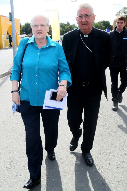 Marie Collins (L), a former member of the Pontifical Commission for Protection of Minors, walks with Archbishop of Dublin Diarmud Martin (R) after taking part in a panel discussion on 'Safeguarding Children and Vulnerable Adults' during the 2018 World Meeting of Families in Dublin