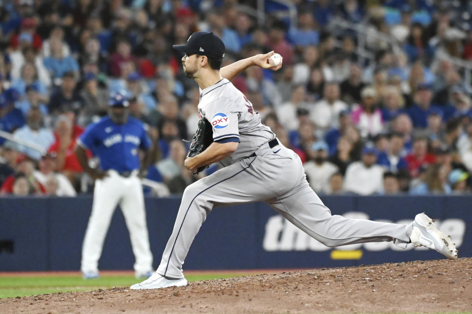 Houston Astros pitcher Seth Martinez (61) works against the Toronto Blue Jays during the eighth inning of a baseball game, Tuesday, July 2, 2024, in Toronto. (Jon Blacker/The Canadian Press via AP)