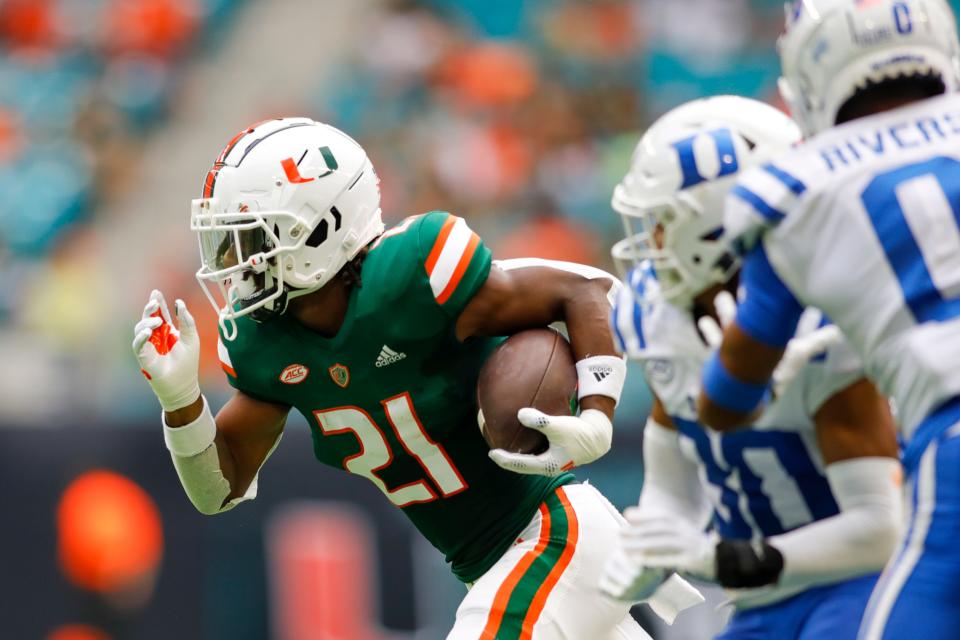 October 22, 2022;  Miami Gardens, Florida, USA;  Miami Hurricanes running back Henry Parrish Jr. (21) runs with the football during the first quarter against the Duke Blue Devils at Hard Rock Stadium.  Mandatory Credit: Sam Navarro-USA TODAY Sports