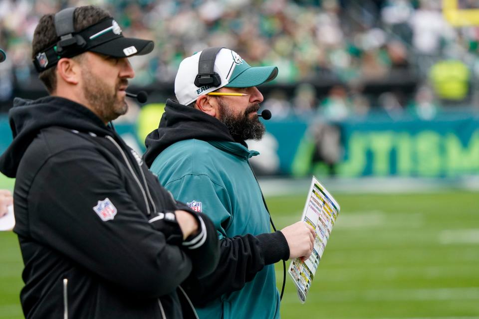 Philadelphia Eagles head coach Nick Sirianni, left, stands with senior defensive assistant Matt Patricia during the first half of an NFL football game against the Arizona Cardinals, Sunday, Dec. 31, 2023, in Philadelphia. (AP Photo/Chris Szagola)