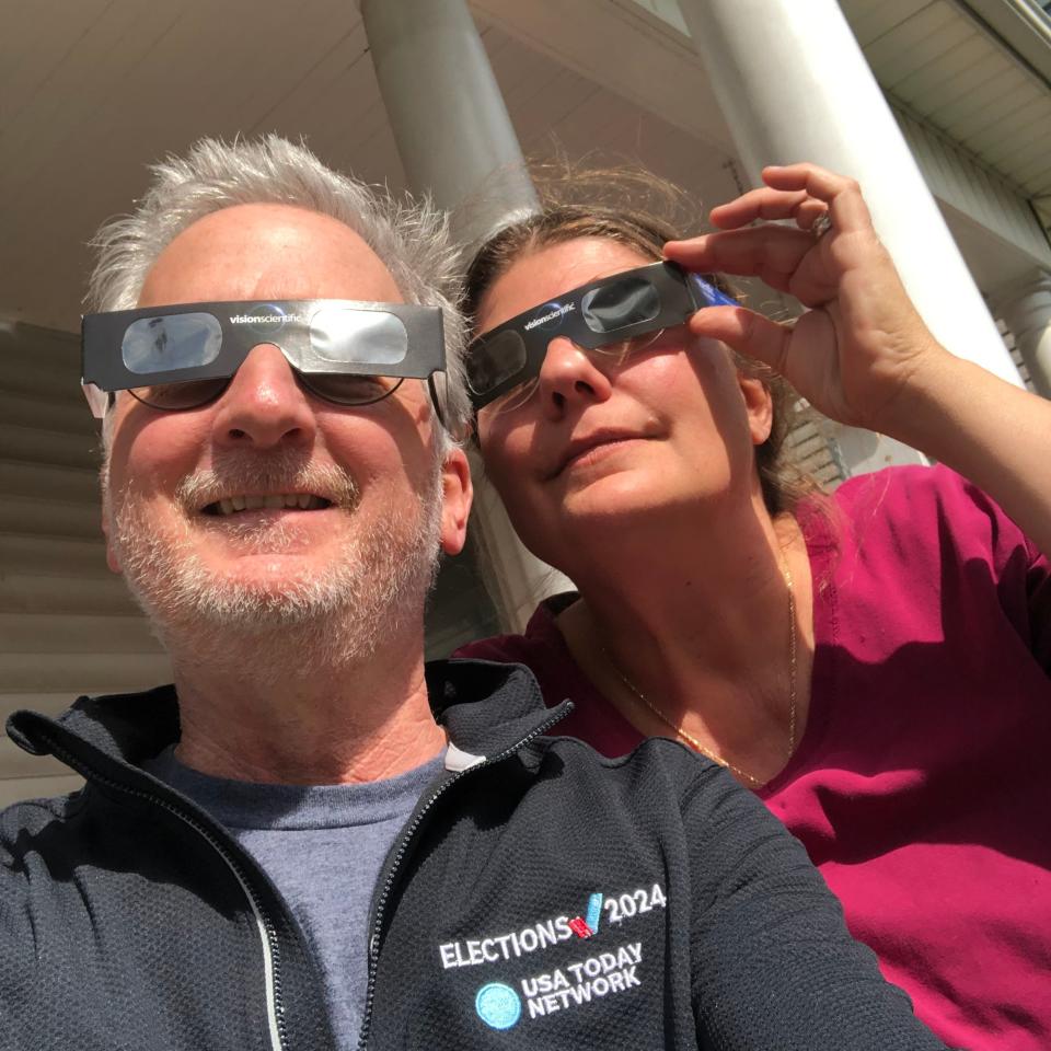 News Leader editor Jeff Schwaner and his wife Mary view the eclipse from their porch on April 8, 2024 in Staunton, Virginia.