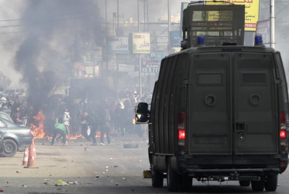 Egyptian security forces clash with supporters of ousted President Mursi at Nasr City district in Cairo