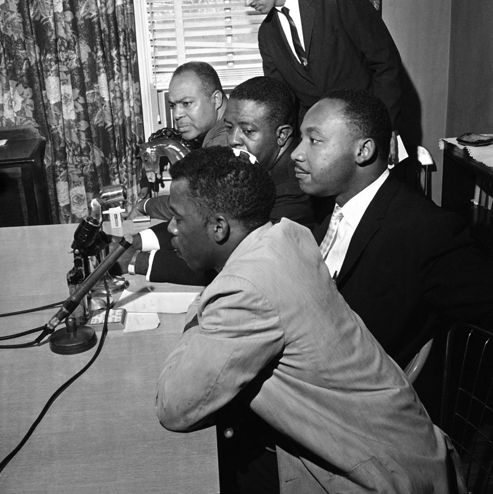 Civil rights leaders hold a news conference in Montgomery, Ala., and announce that the Freedom Rides will continue, May 23, 1961. In the foreground is John Lewis, one of the riders who was beaten. Others, left to right: James Farmer, Rev. Ralph Abernathy and Rev. Martin Luther King. Lewis wears bandage on head. (Photo: AP)