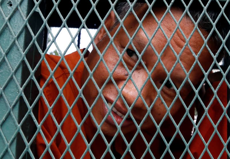 Labor activist Rath Rott Mony arrives to the Phnom Penh Municipal Court for verdict over his role in making a documentary about sex-trafficking that the government said contained fake news, in Phnom Penh