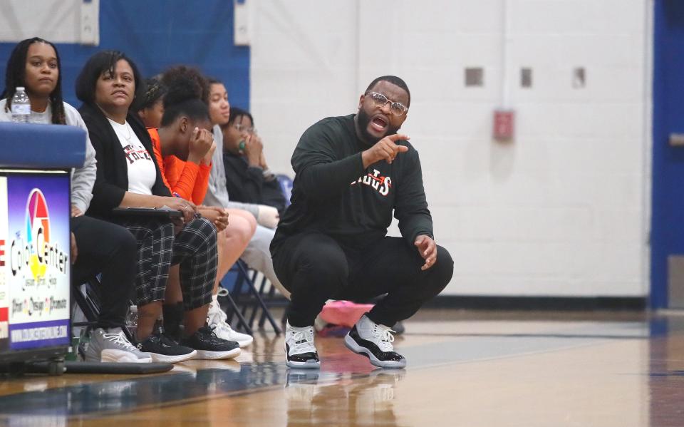 Beaver Falls Head Coach Dom Henderson calls out to his players during the second half against Ellwood City Thursday night at Lincoln High School.