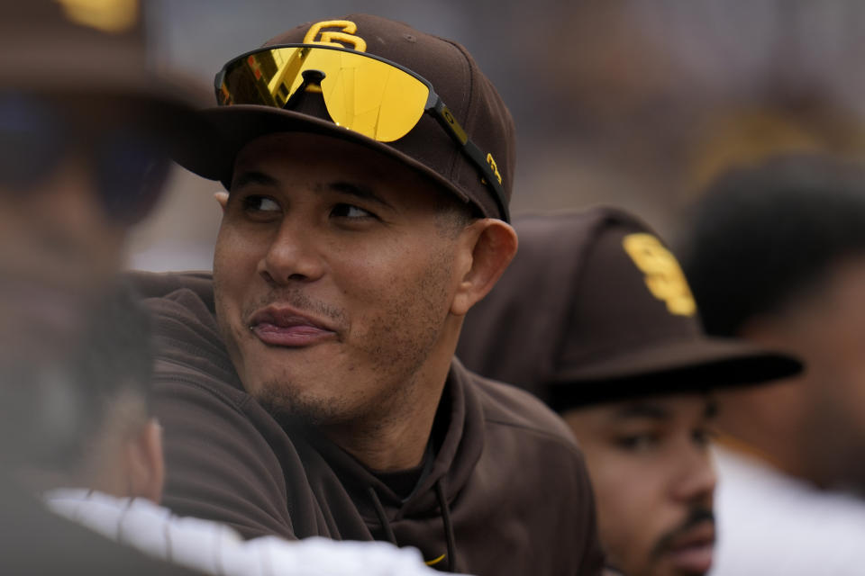 San Diego Padres' Manny Machado looks on from the dugout during the seventh inning of a baseball game against the Kansas City Royals, Wednesday, May 17, 2023, in San Diego. (AP Photo/Gregory Bull)