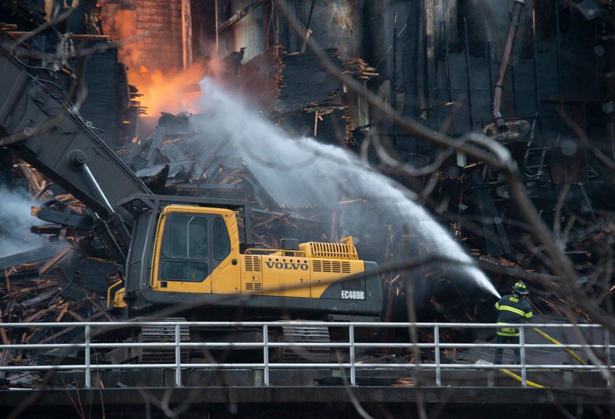 Firefighters continue to put out blazes Saturday, 24 hours after a fire started at the old mill in Kent.