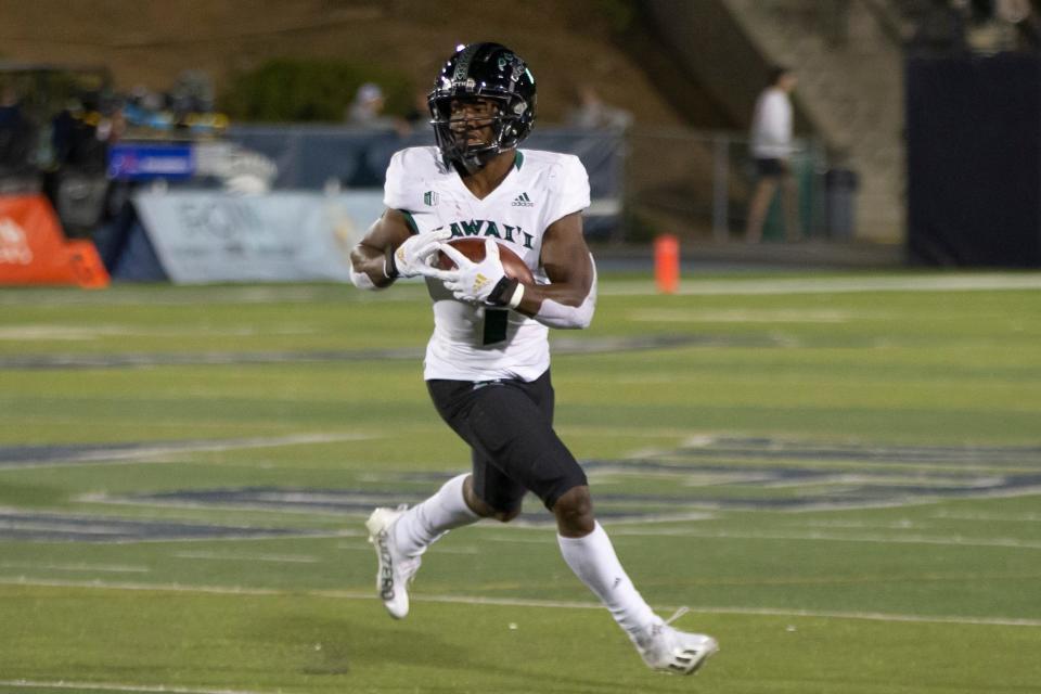 Hawaii running back Calvin Turner Jr. of Savannah runs against Nevada in Reno, Nevada, on Oct. 16, 2021.