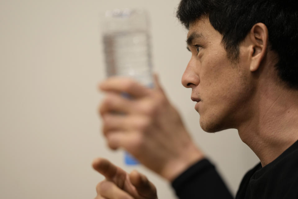 Lee Gwang-jin, who studied Koryo medicine before he fled North Korea in 2018, answers a reporter's question during an interview in Paju, South Korea on July 14, 2022. As a medical student in North Korea, Lee said he treated his fevers and other minor ailments with traditional herbal medicine. But bad illness could mean trouble because hospitals in his rural hometown lacked the ambulances, beds, even the electricity at times needed to treat critical or emergency patients. So Lee was skeptical when he heard recent North Korean state media reports that claimed such so-called Koryo traditional medicine is playing a key role in the nation's fight against COVID-19. (AP Photo/Lee Jin-man)