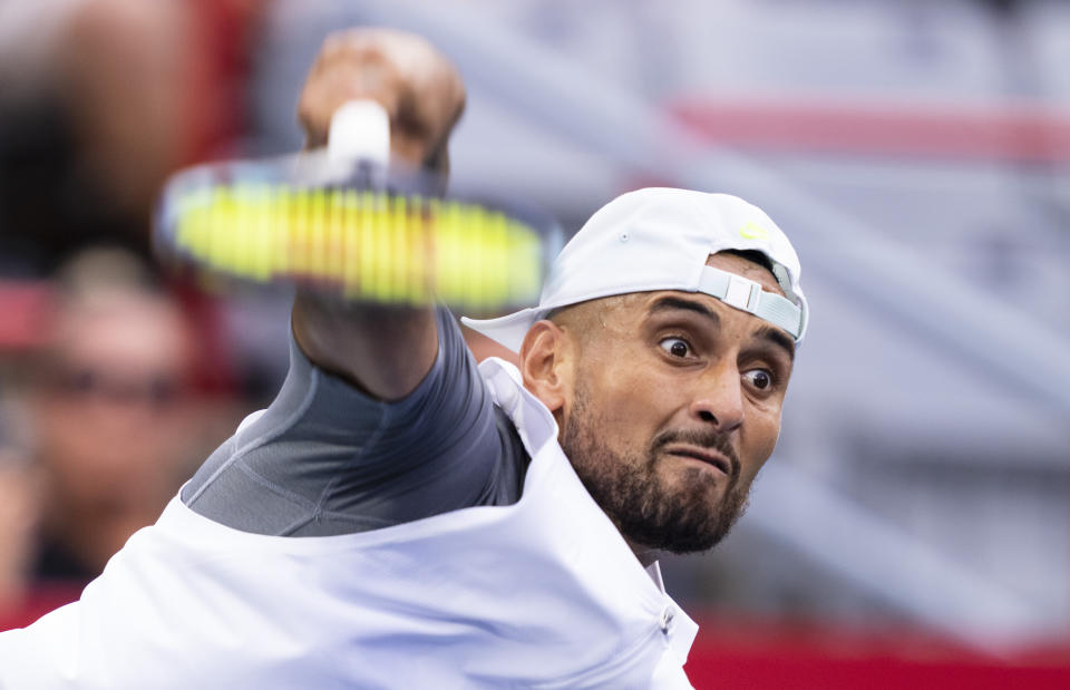 Nick Kyrgios, of Australia, serves to Sebastián Báez, of Argentina, during the National Bank Open tennis tournament Tuesday, Aug. 9, 2022, in Montreal. (Paul Chiasson/The Canadian Press via AP)