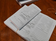 Copies of Kentucky House Bill 2 lie on the clerks desk in the House chambers at the Kentucky state Capitol in Frankfort, Ky., Monday, Dec. 17, 2018. (AP Photo/Timothy D. Easley)