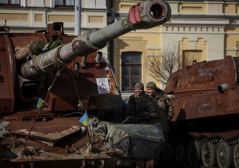 Ukrainian servicemen visit an exhibition displaying destroyed Russian military vehicles in central Kyiv