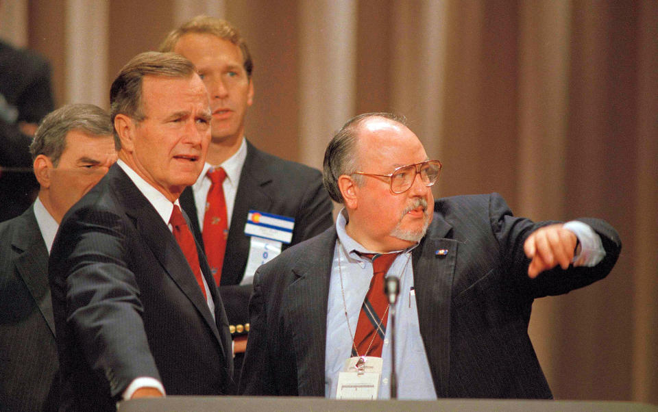 <p>Vice President George H.W. Bush, left, gets some advice from his media adviser, Roger Ailes, right, as they stand behind the podium at the Superdome in New Orleans, prior to the start of the Republican National Convention on Aug. 17, 1988. (Photo: Ron Edmonds/AP) </p>