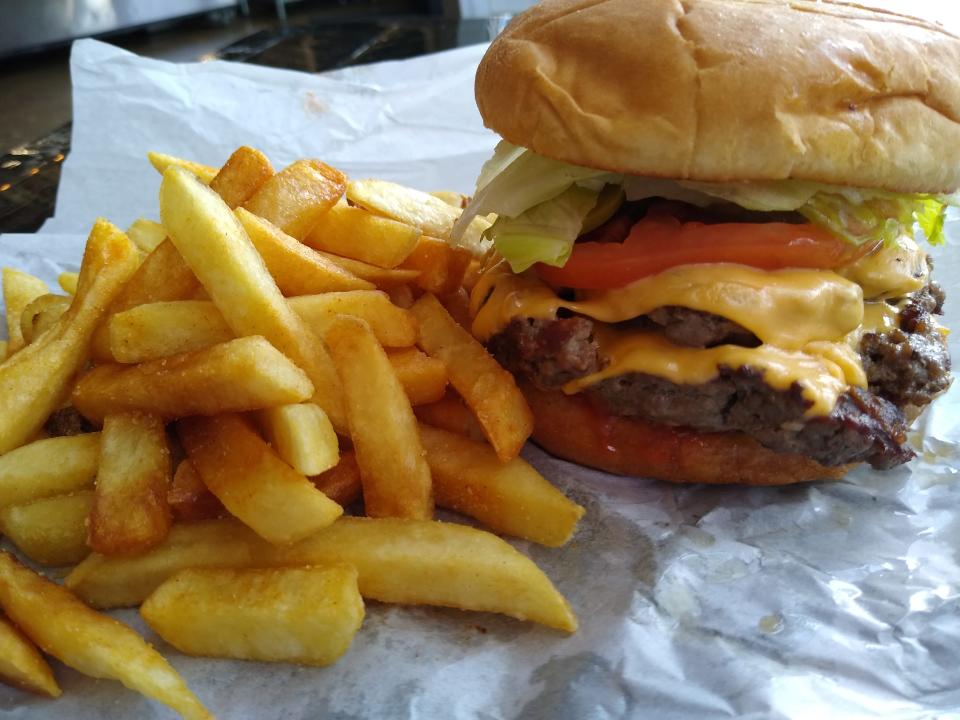A double cheeseburger is served with fries at the Nite Owl on Kenmore Boulevard in Akron.