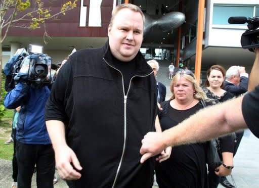 Megaupload boss Kim Dotcom leaves court after he was granted bail at a court in Auckland on February 22. New Zealand police acted illegally when armed officers raided Dotcom's Auckland mansion earlier this year, a High Court judge ruled on Thursday