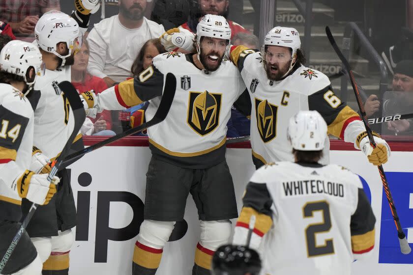 Vegas Golden Knights center Chandler Stephenson (20) is congratulated by his teammates.