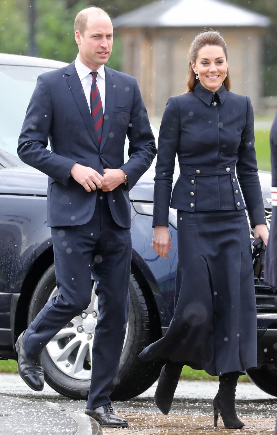 Prince William and Princess Kate recently <a href="https://people.com/royals/future-kings-unite-prince-william-and-prince-charles-have-rare-outing-with-wives-kate-and-camilla/" rel="nofollow noopener" target="_blank" data-ylk="slk:toured the Defence Medical Rehabilitation Centre in Leicestershire;elm:context_link;itc:0;sec:content-canvas" class="link ">toured the Defence Medical Rehabilitation Centre in Leicestershire</a> with Prince Charles and Camilla. For the outing, Kate opted for a navy military-style skirt suit by Alexander McQueen, black heeled boots, and a matching black clutch. <strong>Get the Look!</strong> Luvamia Open Front Long Sleeve Button Front Blazer, $29.99–$36.99; <a href="https://www.amazon.com/luvamia-Womens-Sleeves-Blazer-Buttons/dp/B07JJG1XPY/ref=as_li_ss_tl?ie=UTF8&linkCode=ll1&tag=poamzfkatemiddletonwinterstylekphillips0220-20&linkId=dbdaac39534416916bc1c396bd8aa486&language=en_US" rel="nofollow noopener" target="_blank" data-ylk="slk:amazon.com;elm:context_link;itc:0;sec:content-canvas" class="link ">amazon.com</a> Tommy Hilfiger Military Band Jacket, $65.70 with code LOVE (orig. $109.50); <a href="https://click.linksynergy.com/deeplink?id=93xLBvPhAeE&mid=3184&murl=https%3A%2F%2Fwww.macys.com%2Fshop%2Fproduct%2Ftommy-hilfiger-military-band-jacket%3FID%3D6470223&u1=PEO%2CShopping%3AEverythingYouNeedtoCopyKateMiddleton%E2%80%99sChicWinterStyle%2Ckamiphillips2%2CUnc%2CGal%2C7360903%2C202002%2CI" rel="nofollow noopener" target="_blank" data-ylk="slk:macys.com;elm:context_link;itc:0;sec:content-canvas" class="link ">macys.com</a> Kate Kasin Victorian Steampunk Ringmaster Jacket Military Blazer, $40.99 (orig. $59.99); <a href="https://www.amazon.com/Womens-Victorian-Steampunk-Military-X-Large/dp/B0752TY1NQ/ref=as_li_ss_tl?ie=UTF8&linkCode=ll1&tag=poamzfkatemiddletonwinterstylekphillips0220-20&linkId=bc2febb809d321d3bf4148a3ccd22d5f&language=en_US" rel="nofollow noopener" target="_blank" data-ylk="slk:amazon.com;elm:context_link;itc:0;sec:content-canvas" class="link ">amazon.com</a> Lioness Palermo Blazer, $88; <a href="https://click.linksynergy.com/deeplink?id=93xLBvPhAeE&mid=42352&murl=https%3A%2F%2Fwww.shopbop.com%2Fpalermo-blazer-lioness%2Fvp%2Fv%3D1%2F1578043974.htm&u1=PEO%2CShopping%3AEverythingYouNeedtoCopyKateMiddleton%E2%80%99sChicWinterStyle%2Ckamiphillips2%2CUnc%2CGal%2C7360903%2C202002%2CI" rel="nofollow noopener" target="_blank" data-ylk="slk:shopbop.com;elm:context_link;itc:0;sec:content-canvas" class="link ">shopbop.com</a> Curlbiuty Casual Stand Collar Buttons Military Blazer, $19.99–$31.99; <a href="https://www.amazon.com/Blazer-Casual-Buttons-Military-Jacket/dp/B07VNXDNK3/ref=as_li_ss_tl?ie=UTF8&linkCode=ll1&tag=poamzfkatemiddletonwinterstylekphillips0220-20&linkId=8807fe8fd52a1a12d45fe22e42ace08d&language=en_US" rel="nofollow noopener" target="_blank" data-ylk="slk:amazon.com;elm:context_link;itc:0;sec:content-canvas" class="link ">amazon.com</a>