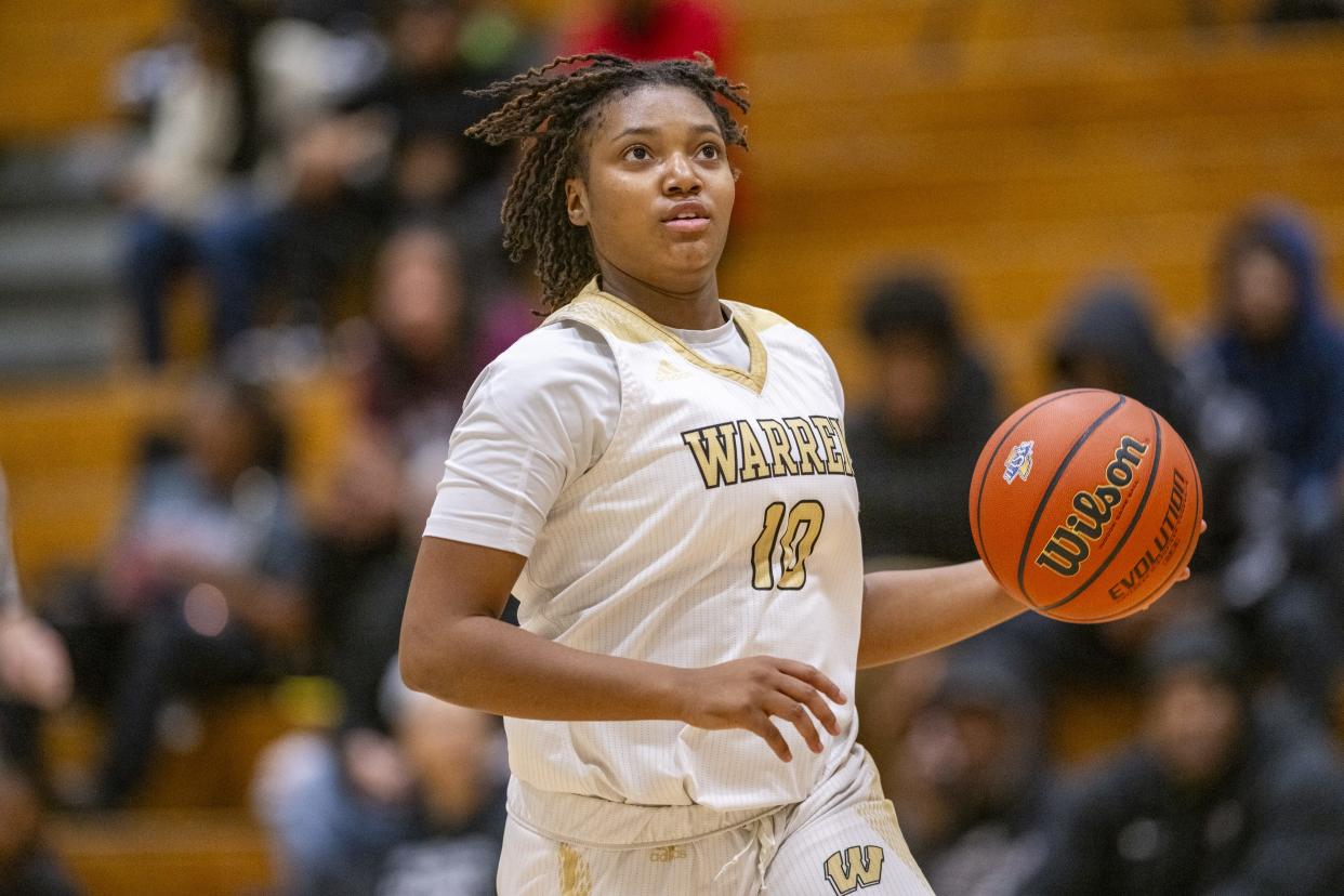 Warren Central High School senior Denyha Jacobs (10) brings the ball up court during the first half of an IHSAA Class 4A Sectional semi-final basketball game against Indianapolis Arsenal Technical High School, Friday, Feb. 2, 2024, at Cathedral High School.