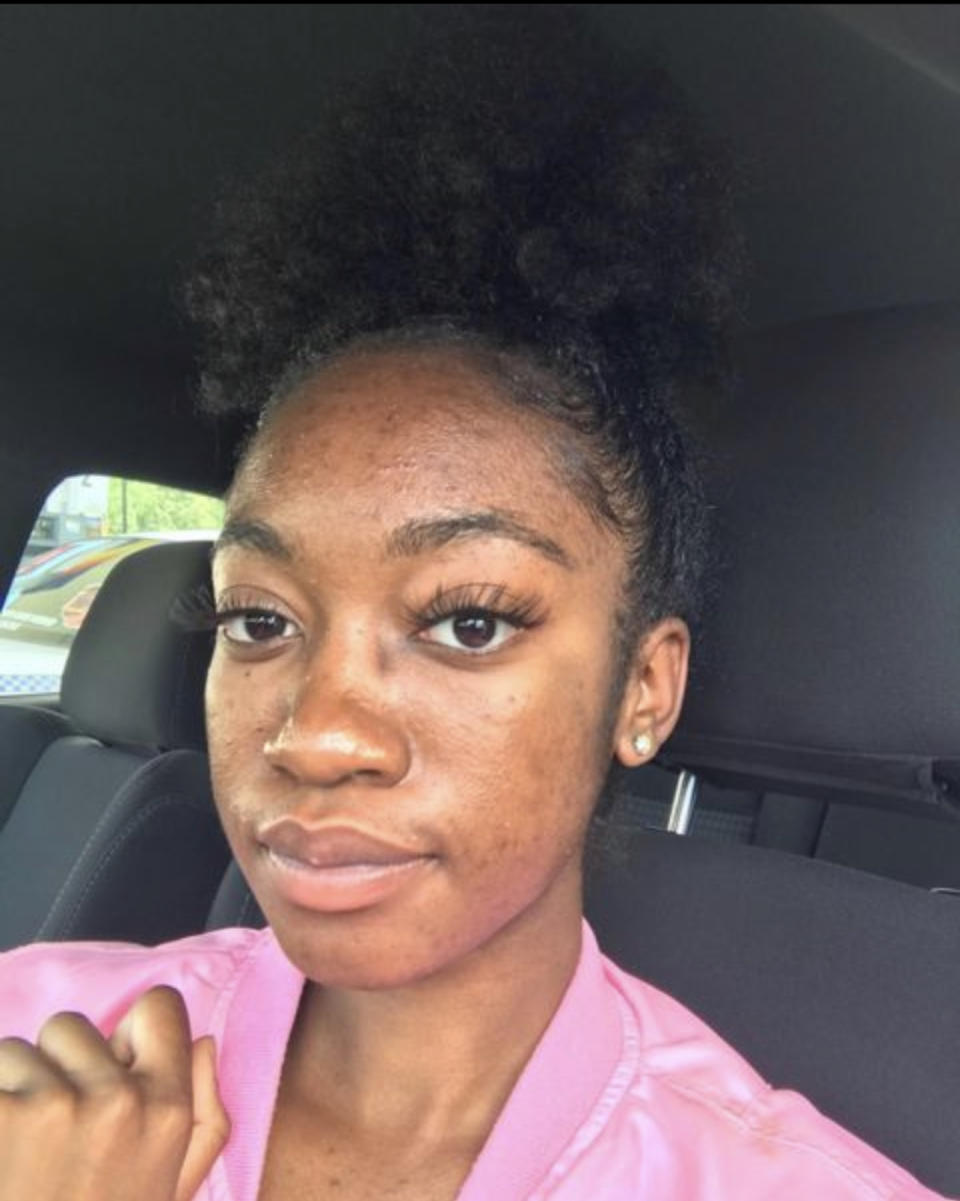 Cassy Jean is pictured in the driver's seat of a vehicle.