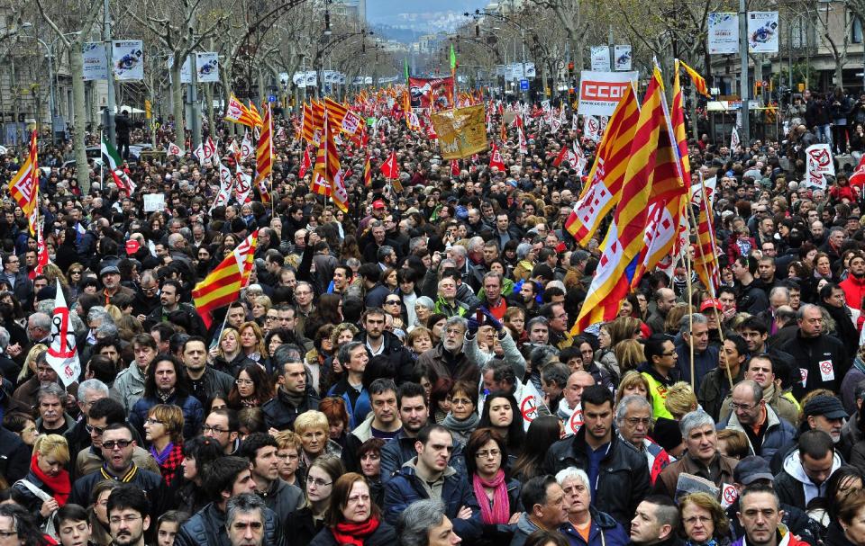 Protesters take part during a rally against the economic policy of the Conservative Spanish Government in Barcelona, Spain, Sunday, Feb. 19, 2012. The new conservative Popular Party government pledges new labor reforms to try to halt further job destruction as Spain already has the highest unemployment rate in the 17-nation eurozone with more than five millions unemployed and more than eleven million people at risk of social exclusion, as a result of the economic crisis. (AP Photo/Manu Fernandez)