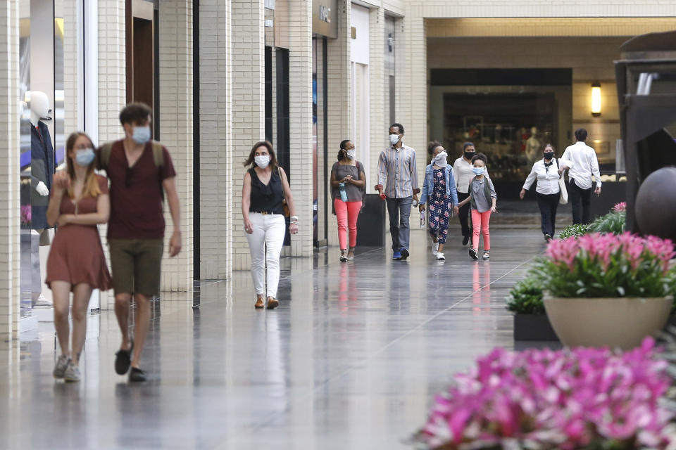 Shoppers walk through a shopping centre. Source: AAP