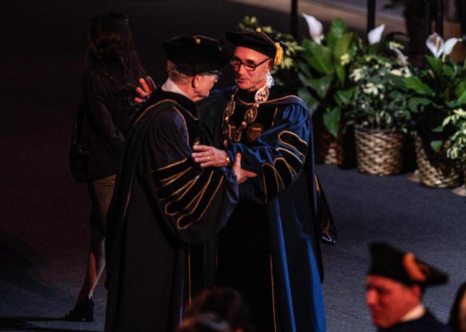 Former FIU president Mark Rosenberg (left) greets Kenneth Jessell during his investiture ceremony where he was sworn in as FIU’s sixth president, Ocean Bank Convocation Center at Florida International University’s Modesto A. Maidique campus in Miam-Dade, Thursday May 18 , 2023.