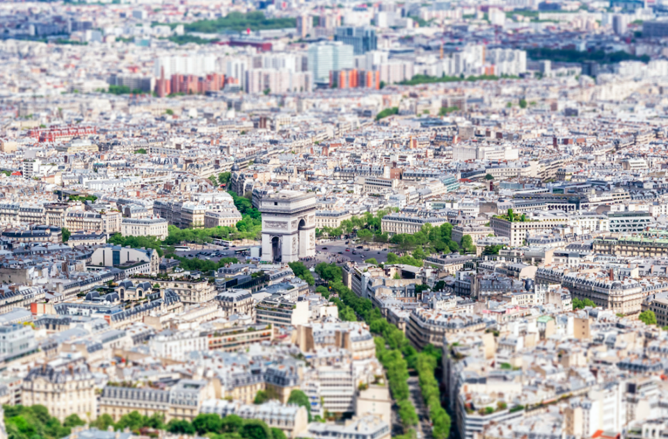 The Arc de Triomphe lies in the centre of an intricate-looking Paris.