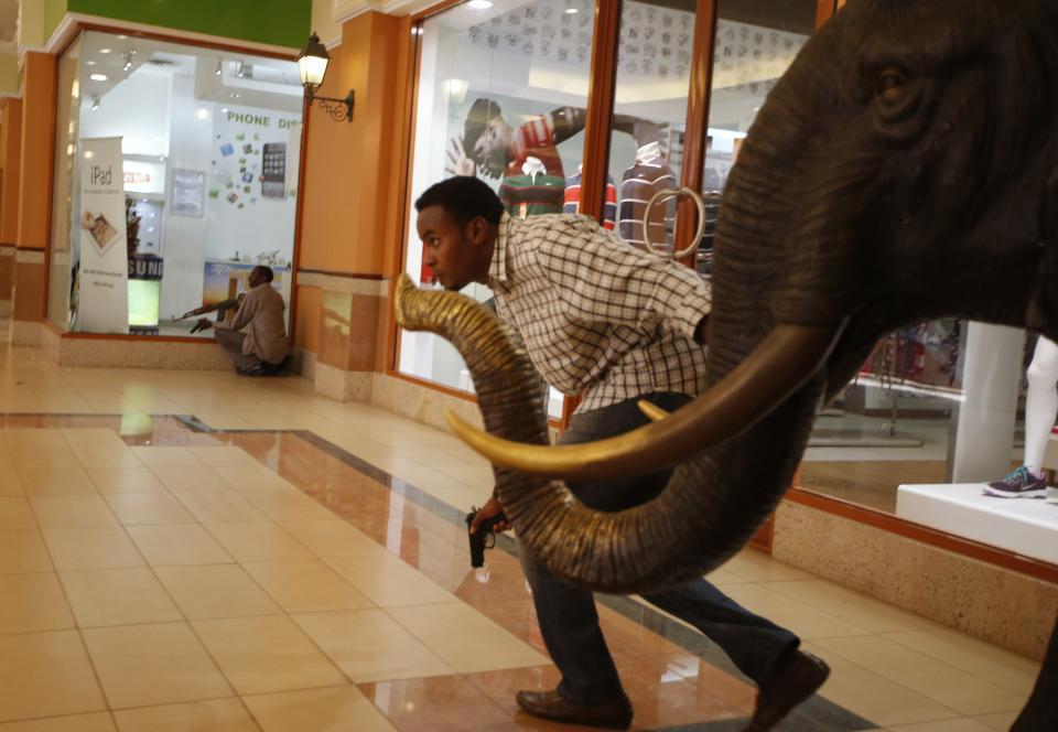 Armed police search through Westgate shopping centre for gunmen in Nairobi, September 21, 2013. (REUTERS/Goran Tomasevic)