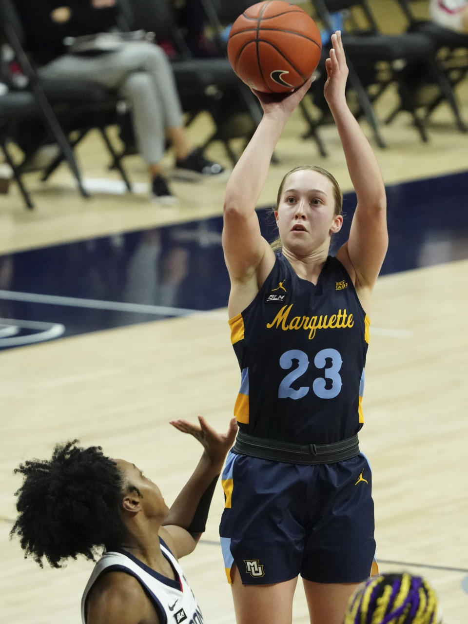 Marquette guard Jordan King (23) shoots against Connecticut guard Christyn Williams (13) in the second half of an NCAA college basketball game Monday, March 1, 2021, in Storrs, Conn. (David Butler II/Pool Photo via AP)