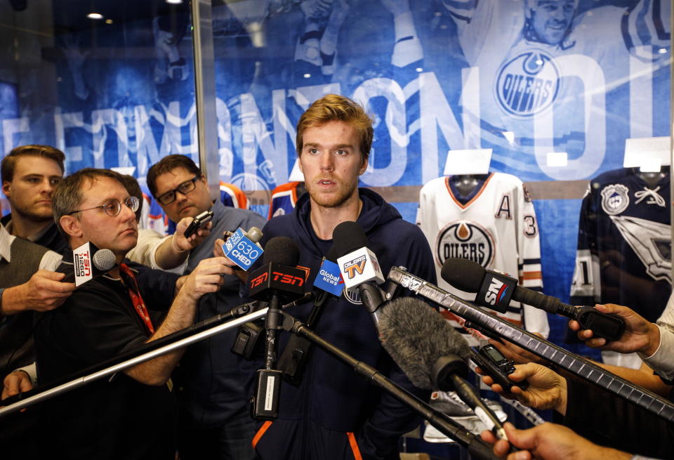 Edmonton Oilers NHL hockey player Connor McDavid speaks to media during the Oilers training camp in Edmonton, Alberta Thursday Sept, 12, 2019. (Jason Franson/The Canadian Press via AP)