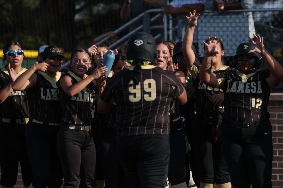 Lamesa's Zoey Sifuentes, middle, runs towards home plate while her team reacts to her home run against Tulia in Game 2 of the Class 3A area-round softball series, Friday, May 3, 2024, at First United Park in Woodrow.