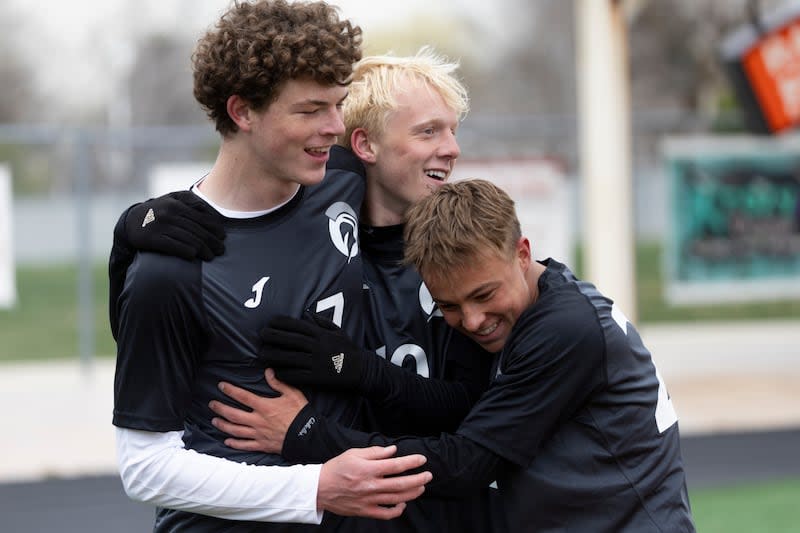 Murray Spartans Dillon Curtis (17), Murray Spartans Preston Lawson (10), and Murray Spartans Jacob Riches (22) celebrate a goal during a game against the Park City Miners at Murray High School in Murray on Friday, April 5, 2024.