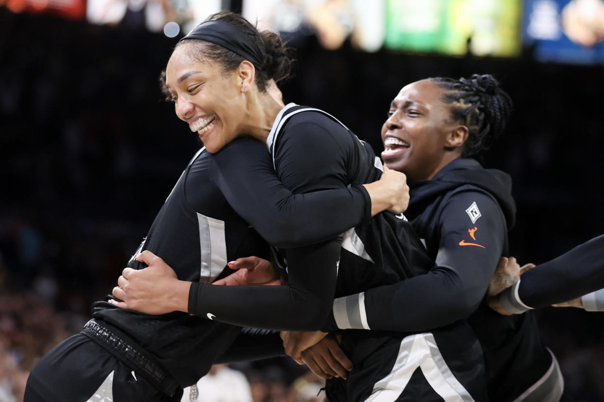 LAS VEGAS, NEVADA - SEPTEMBER 15: A'ja Wilson (L) #22 and Chelsea Gray #12 of the Las Vegas Aces celebrate after Wilson became the first player in WNBA history to score 1,000 points in a regular season, reaching that milestone in the fourth quarter of a game against the Connecticut Sun at Michelob ULTRA Arena on September 15, 2024, in Las Vegas, Nevada. The Aces defeated the Sun 84-71. NOTE TO USER: User expressly acknowledges and agrees that, by downloading and or using this photograph, User is consenting to the terms and conditions of the Getty Images License Agreement. (Photo by Ian Maule/Getty Images)