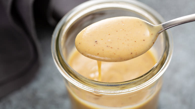 Spoon and jar of dressing